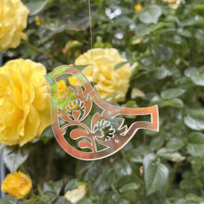 Transparent bird with folk pattern